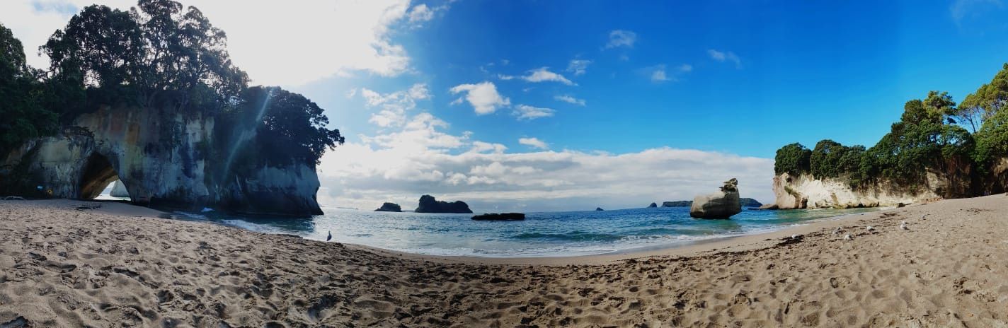 Beach with blue sea and sky in the background