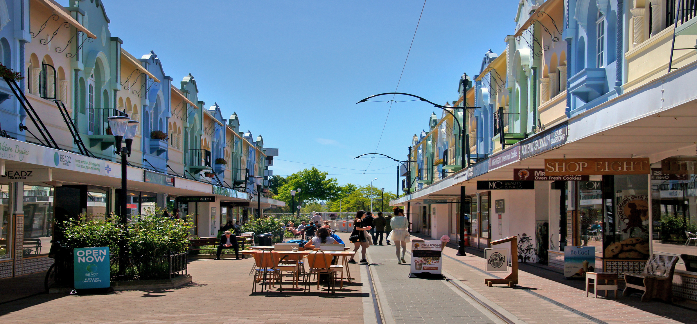 A street with traditional heritage buildings housing restaurants and shops