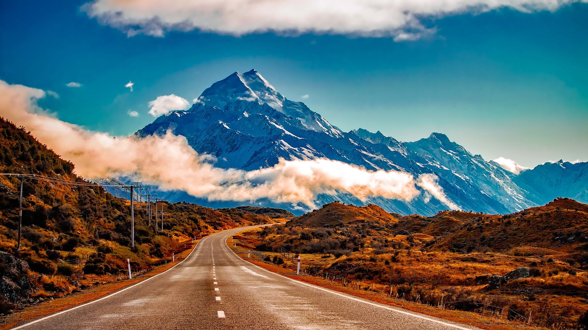 The Road to Mount Cook National Park, New Zealand Road leading to a mountain near Mount Cook, New Zealand