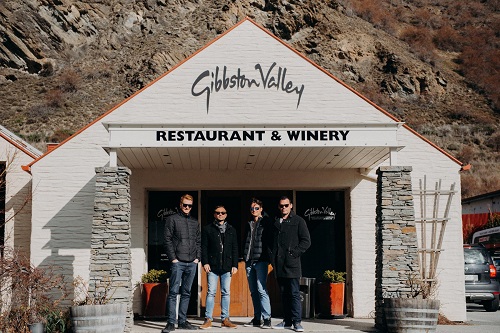 A group of men standing in the entrance of Gibbston Winery near Queenstown, New Zealand