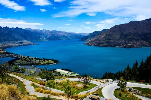 Aerial view of Queenstown with a lake and mountain background