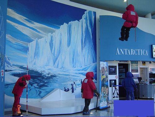 People in anoraks at an Antarctic exhibition museum