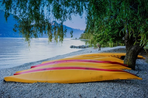 Colourful boats beside water at Queenstown, New Zealand